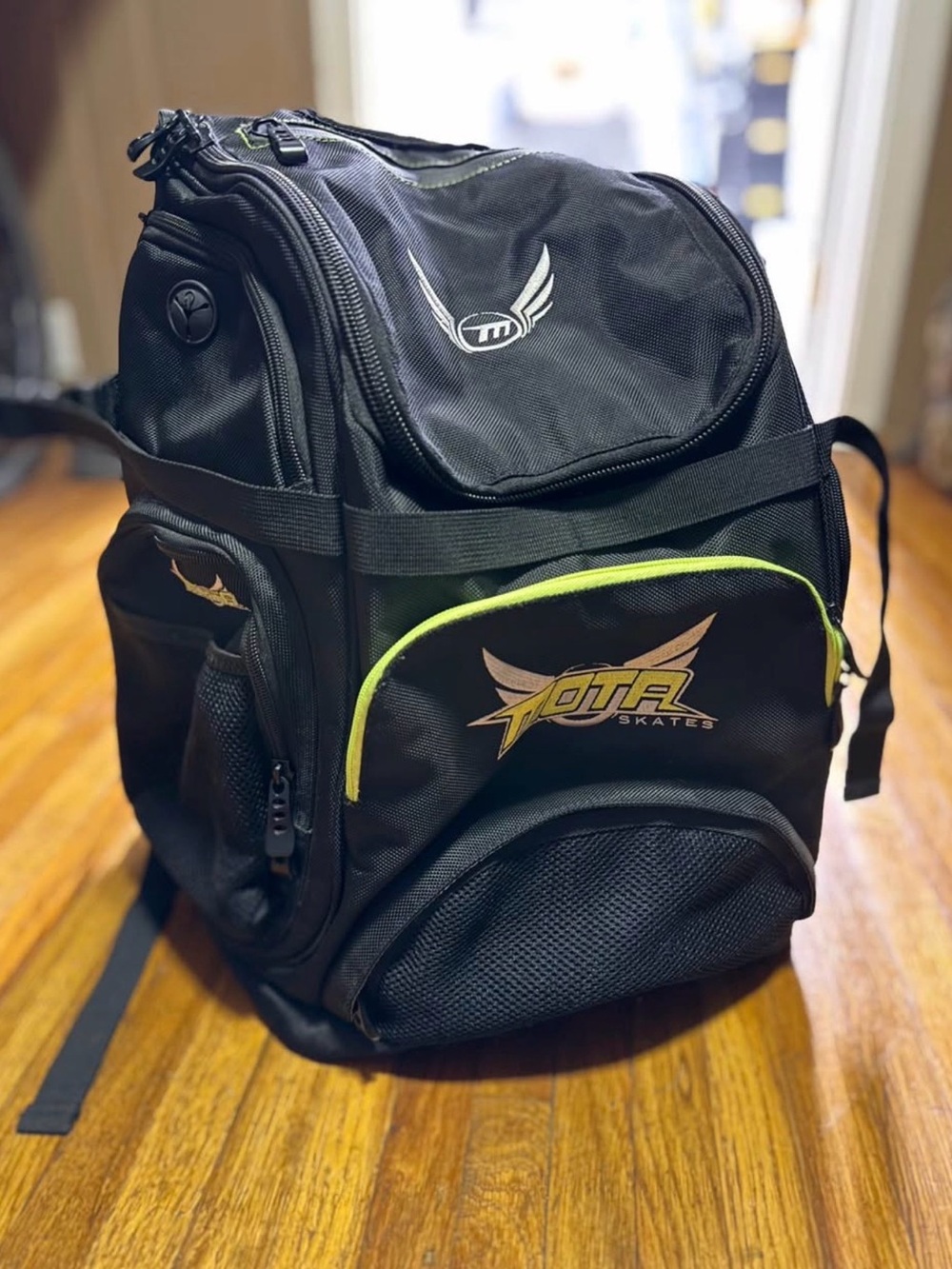 Black Backpack with Lime Trim to hold skates